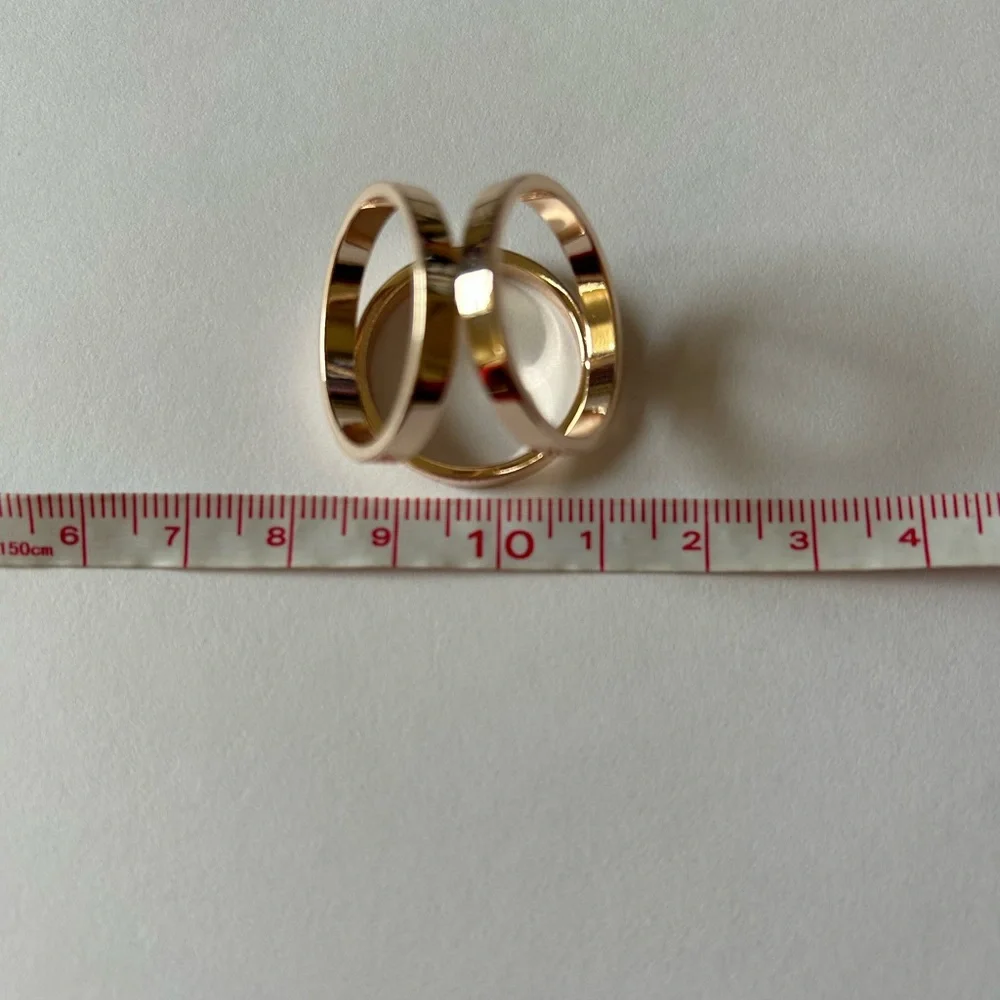 Rose gold tone interlocking scarf ring model sculptural design - Picture 5 of 5